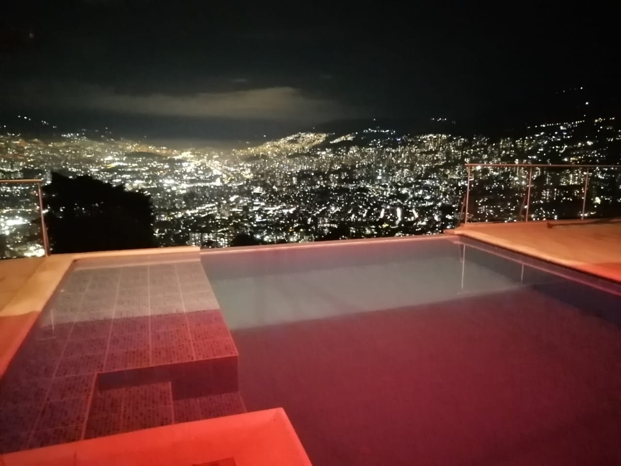 The View infinity pool and city atmosphere at night