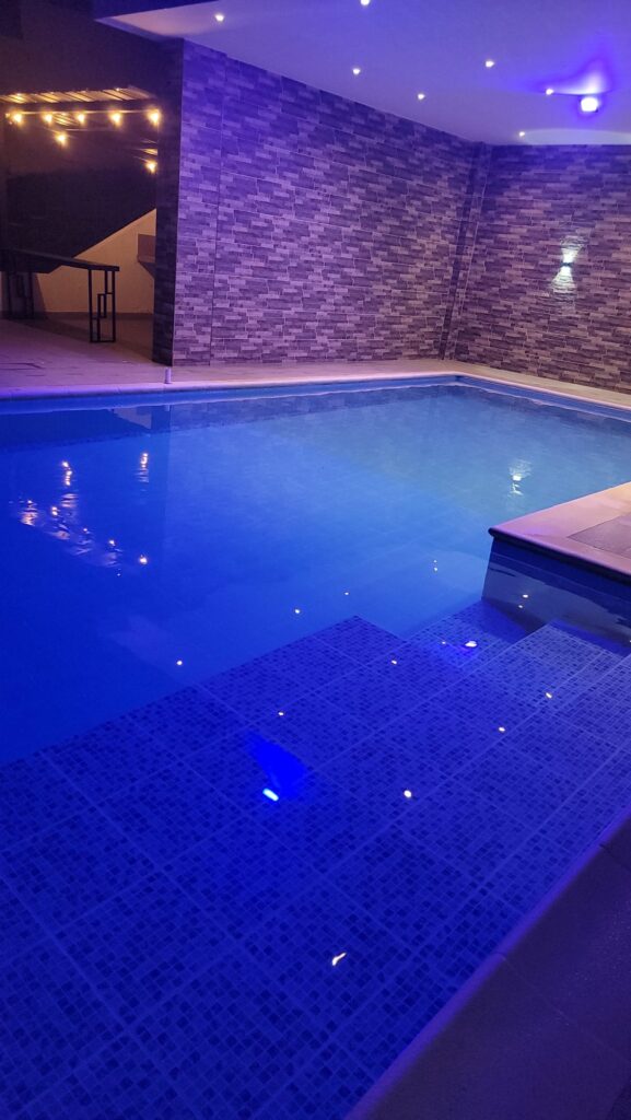 Heated infinity pool experience and elevated views at The View Modern Mansion VIP Retreat